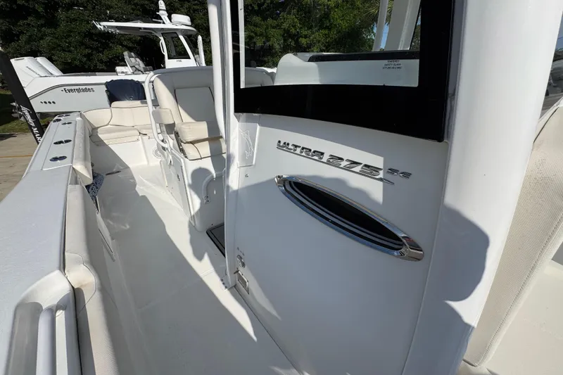 Slide: The Image of 2022 Sea Hunt Ultra 275 SE boat interior with seating and branding details. - 21