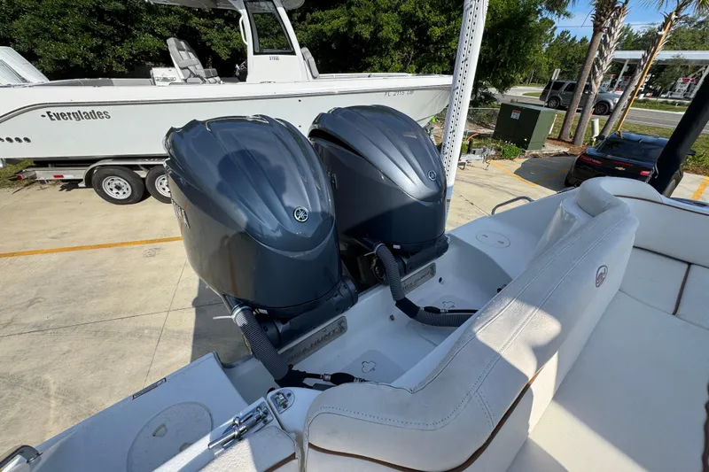 Slide: The Image of 2022 Sea Hunt Ultra 275 SE with dual Yamaha outboard engines, parked on a trailer. - 35