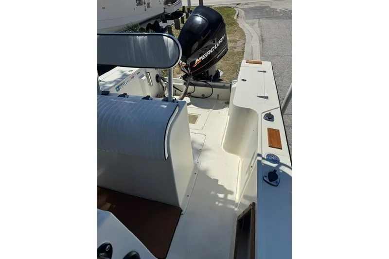 Slide: The Image of 1987 Mako 232 Center Console boat interior with Mercury outboard motor. - 12