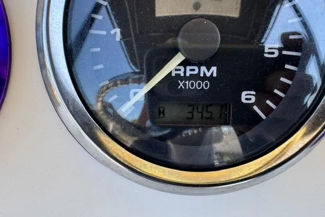 Slide: The Image of Close-up of RPM gauge on 1987 Mako 232 Center Console boat, showing 3451 RPM. - 16