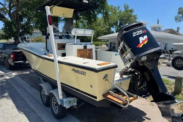 Slide: The Image of 1987 Mako 232 Center Console boat on trailer with Mercury 225 outboard motor. - 3