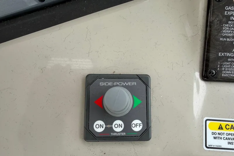 Slide: The Image of Side-Power thruster control panel on a 2006 Sea Ray 38 Sundancer boat. - 13