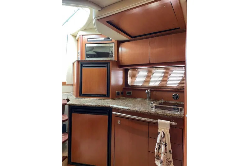 Slide: The Image of Luxurious 2006 Sea Ray 38 Sundancer yacht interior with modern kitchen amenities. - 16