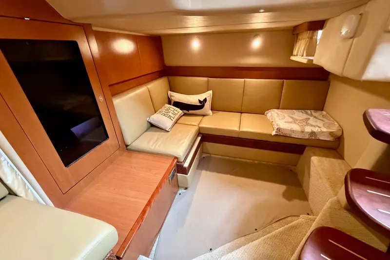 Slide: The Image of Luxurious interior of 2006 Sea Ray 38 Sundancer yacht with cozy seating area. - 23
