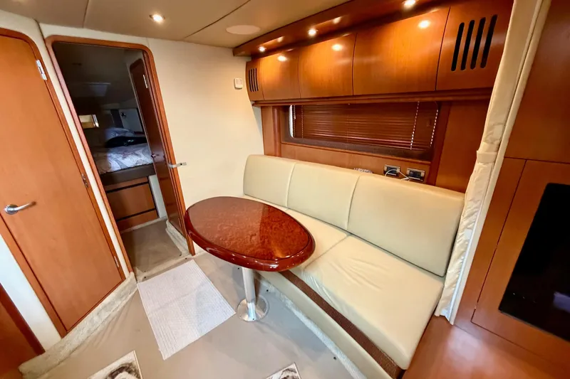 Slide: The Image of Interior of 2006 Sea Ray 38 Sundancer yacht with elegant seating and wooden finishes. - 27