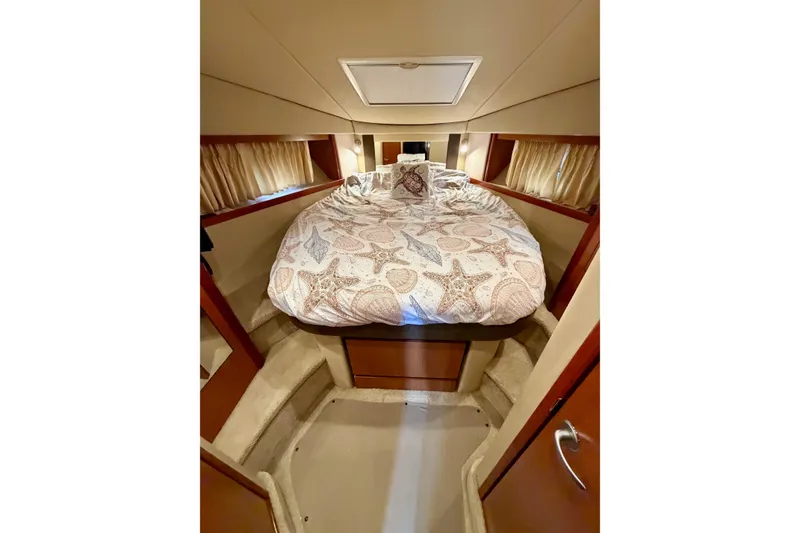 Slide: The Image of Luxurious cabin interior of 2006 Sea Ray 38 Sundancer yacht with cozy bedding. - 31