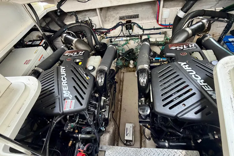 Slide: The Image of Engine room of a 2006 Sea Ray 38 Sundancer with twin Mercury engines. - 35