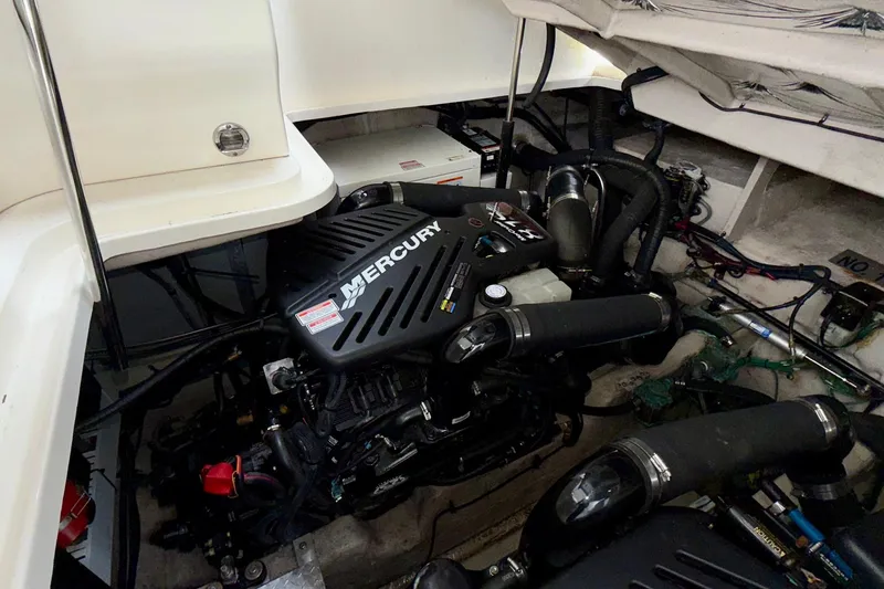 Slide: The Image of Engine compartment of a 2006 Sea Ray 38 Sundancer with Mercury engine. - 36