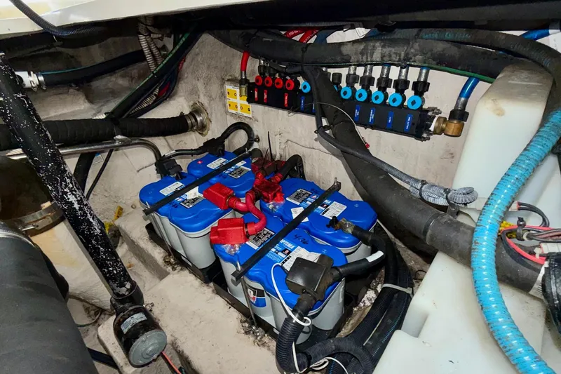 Slide: The Image of Engine compartment of a 2006 Sea Ray 38 Sundancer with batteries and wiring. - 38