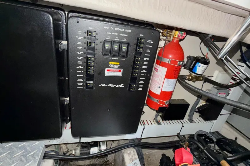 Slide: The Image of Electrical panel and fire extinguisher in 2006 Sea Ray 38 Sundancer boat engine room. - 39