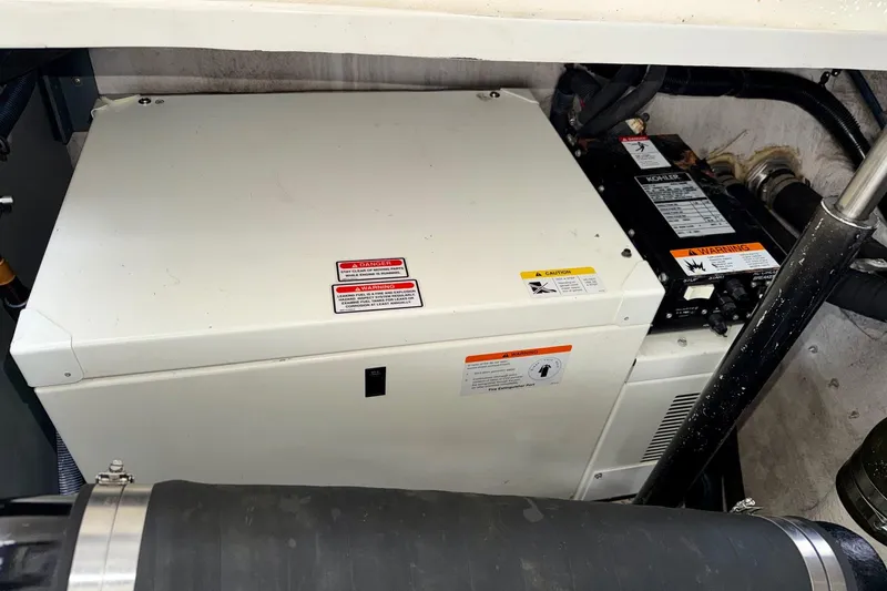 Slide: The Image of Engine compartment of a 2006 Sea Ray 38 Sundancer with Kohler generator. - 41