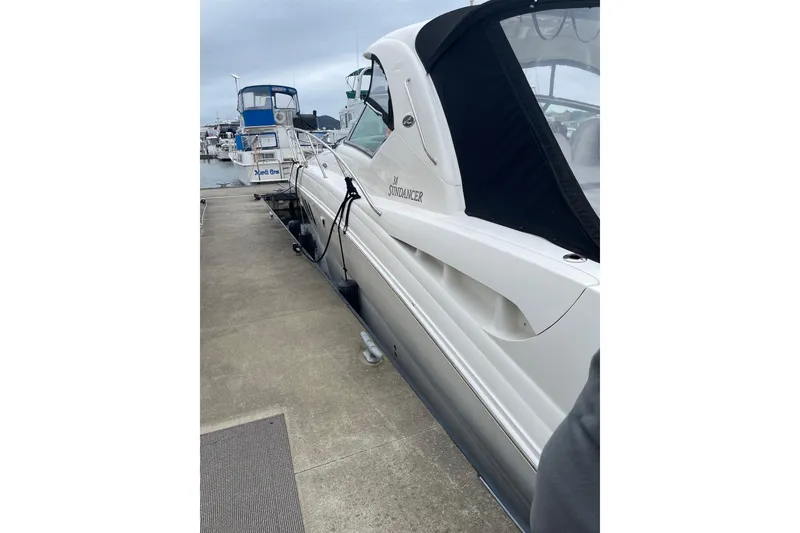 Slide: The Image of 2006 Sea Ray 38 Sundancer yacht docked at marina, side view. - 49