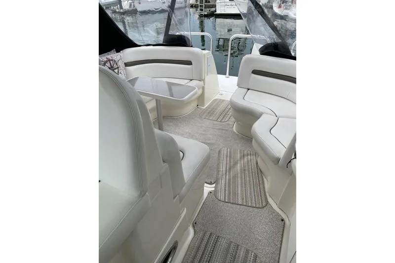 Slide: The Image of Interior of 2006 Sea Ray 38 Sundancer yacht with plush seating and table. - 5