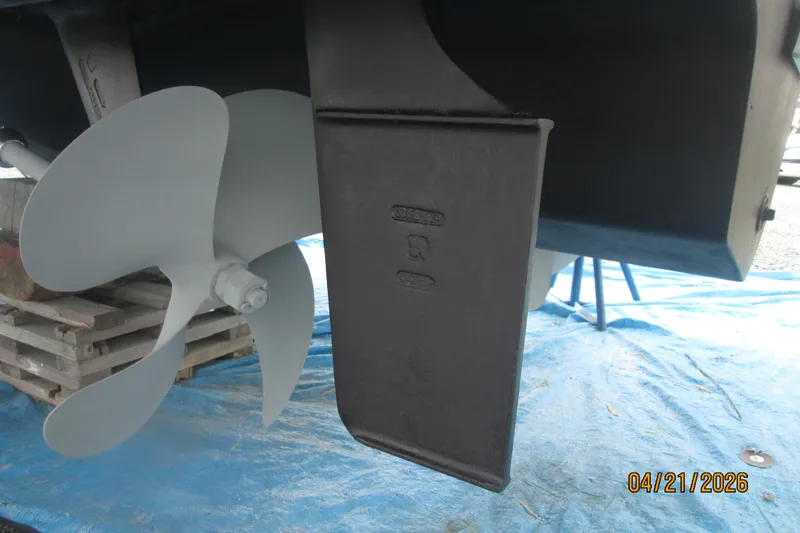 Slide: The Image of Propeller and rudder of 2006 Sea Ray 38 Sundancer on blue tarp. - 56
