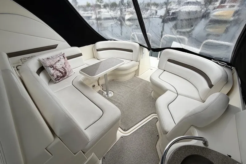 Slide: The Image of Luxurious interior of 2006 Sea Ray 38 Sundancer yacht with plush seating and table. - 6