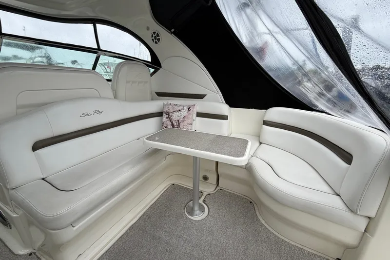 Slide: The Image of Luxurious interior of 2006 Sea Ray 38 Sundancer with elegant seating and table. - 7