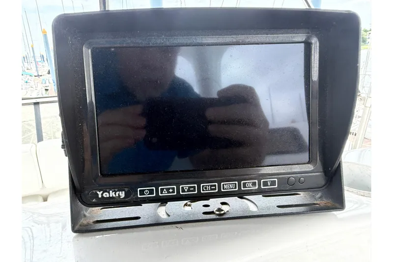 Slide: The Image of Yakry monitor on a 1999 Silverton 352 Motor Yacht, reflecting surroundings. - 21