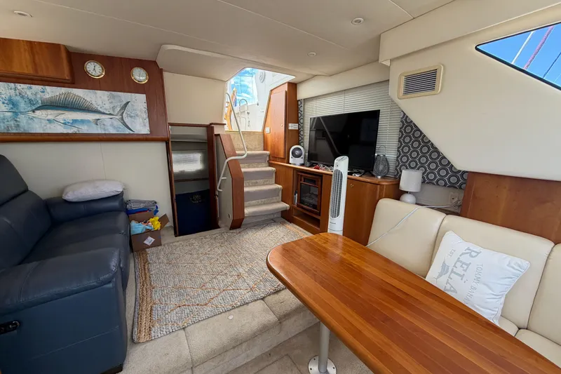 Slide: The Image of Interior of 1999 Silverton 352 Motor Yacht with cozy seating and modern amenities. - 35