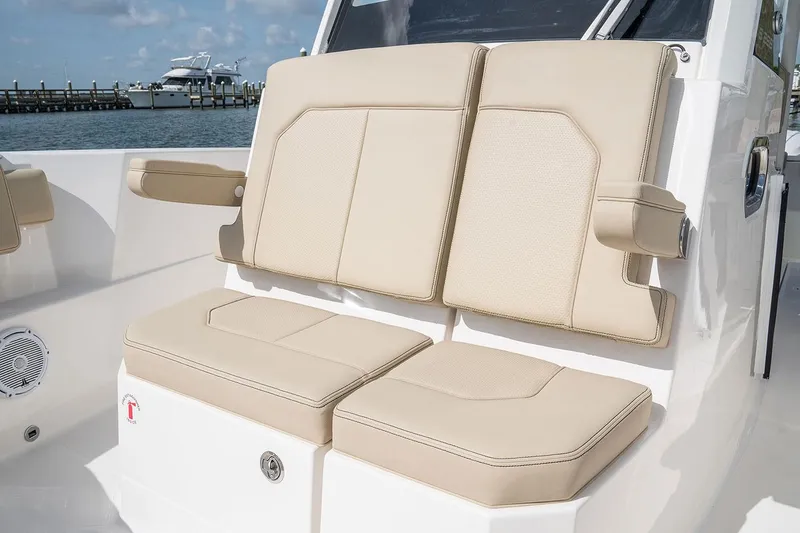 Slide: The Image of Manufacturer Provided Image: 2025 Pursuit S 288 Sport boat with beige cushioned seating. - 11