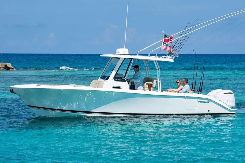 Slide: The Image of Manufacturer Provided Image: 2025 Pursuit S 288 Sport boat cruising on clear blue ocean waters. - 6