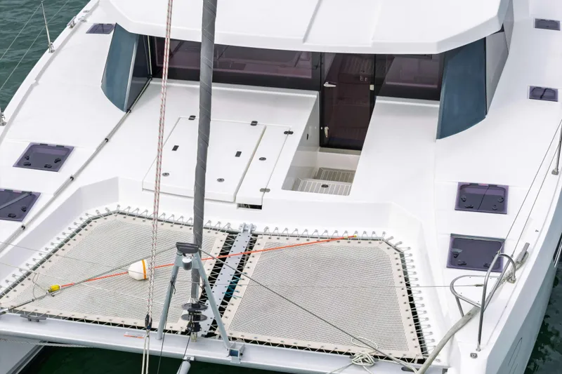 Slide: The Image of 2022 Leopard 42 catamaran deck with netting and sleek design. - 14