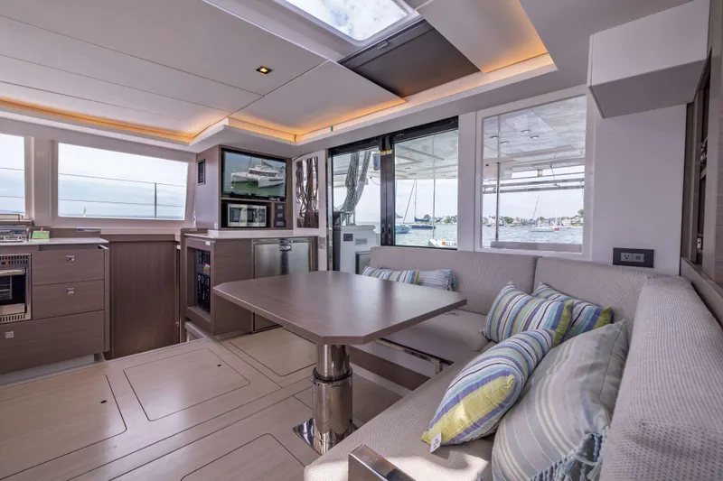 Slide: The Image of Luxurious interior of 2022 Leopard 42 yacht with modern dining area and scenic windows. - 33