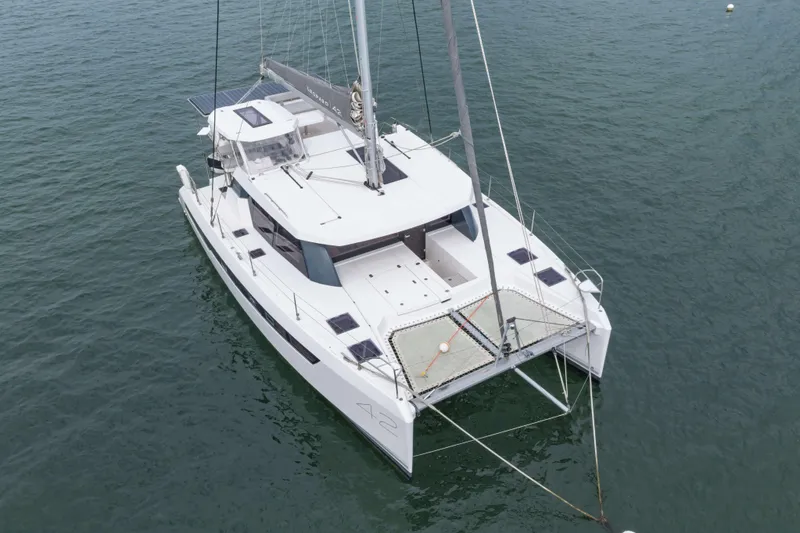 Slide: The Image of 2022 Leopard 42 catamaran sailing on calm waters, aerial view. - 8
