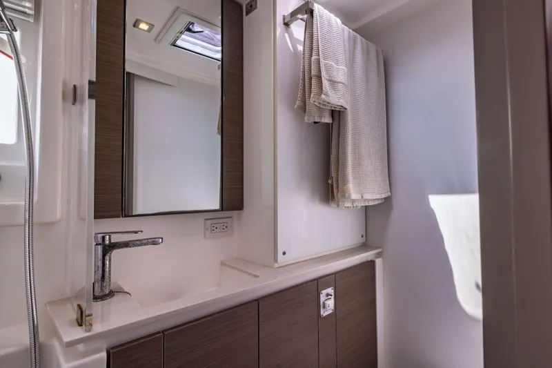 Slide: The Image of Modern bathroom interior on 2022 Leopard 42 yacht, featuring sleek fixtures and towel rack. - 54
