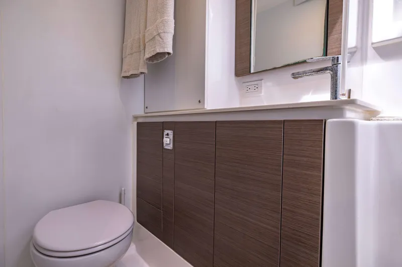 Slide: The Image of Modern bathroom in 2022 Leopard 42 yacht with sleek wood cabinetry and elegant fixtures. - 45