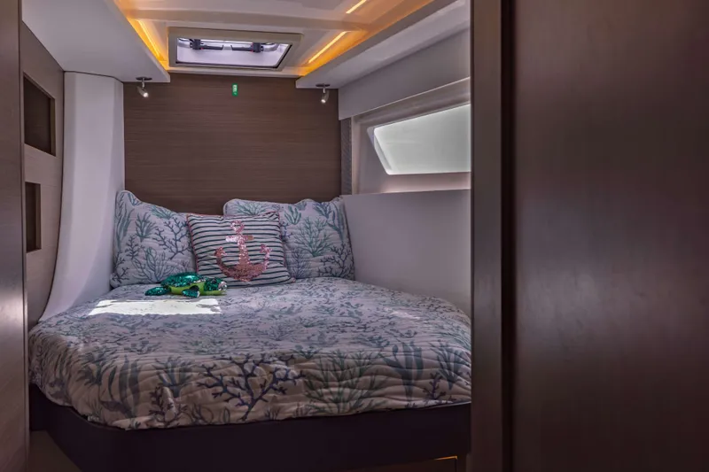 Slide: The Image of Cozy bedroom in 2022 Leopard 42 yacht with nautical-themed bedding. - 52