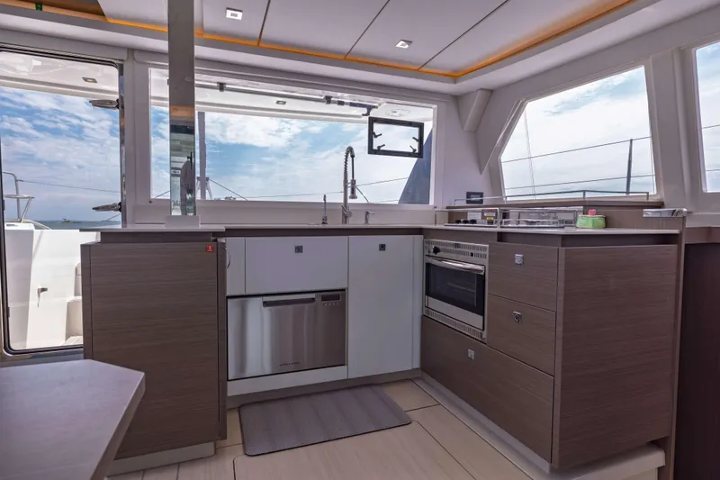 Slide: The Image of Modern kitchen interior on 2022 Leopard 42 yacht, featuring sleek cabinetry and ocean views. - 40