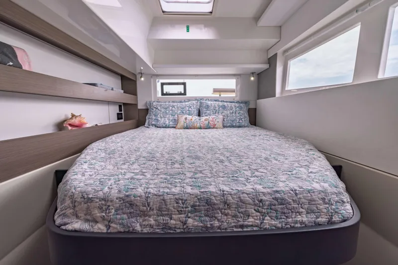 Slide: The Image of Luxurious bedroom interior of 2022 Leopard 42 yacht with cozy bedding and natural light. - 47