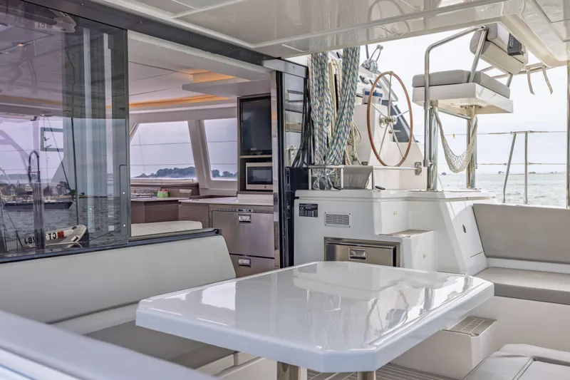 Slide: The Image of Luxurious 2022 Leopard 42 yacht interior with modern seating and helm, overlooking the ocean. - 25