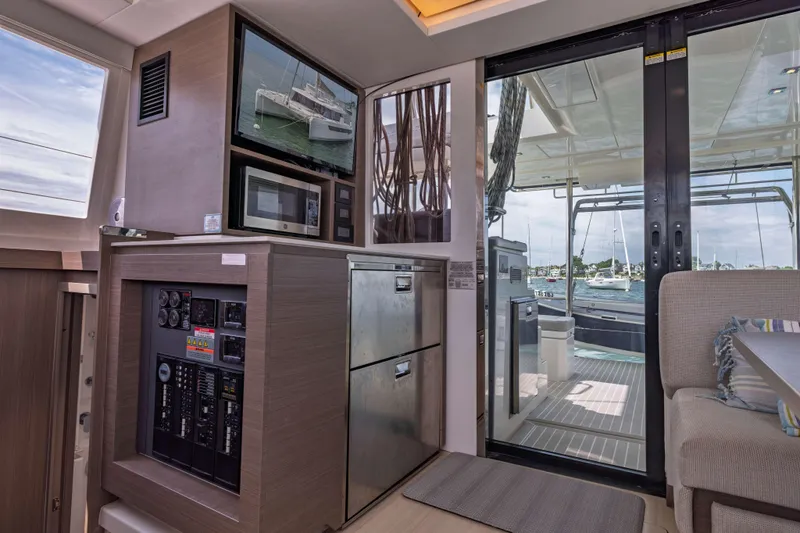 Slide: The Image of Interior of 2022 Leopard 42 yacht with modern kitchen and sliding glass doors. - 31