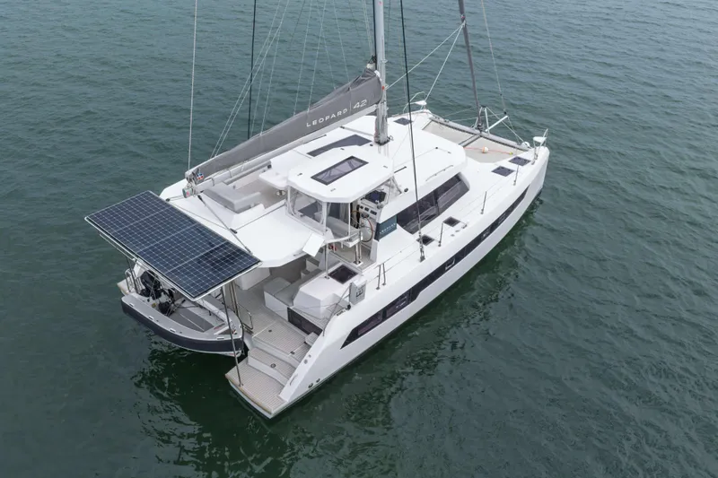 Slide: The Image of 2022 Leopard 42 catamaran with solar panels, sailing on calm waters. - 9