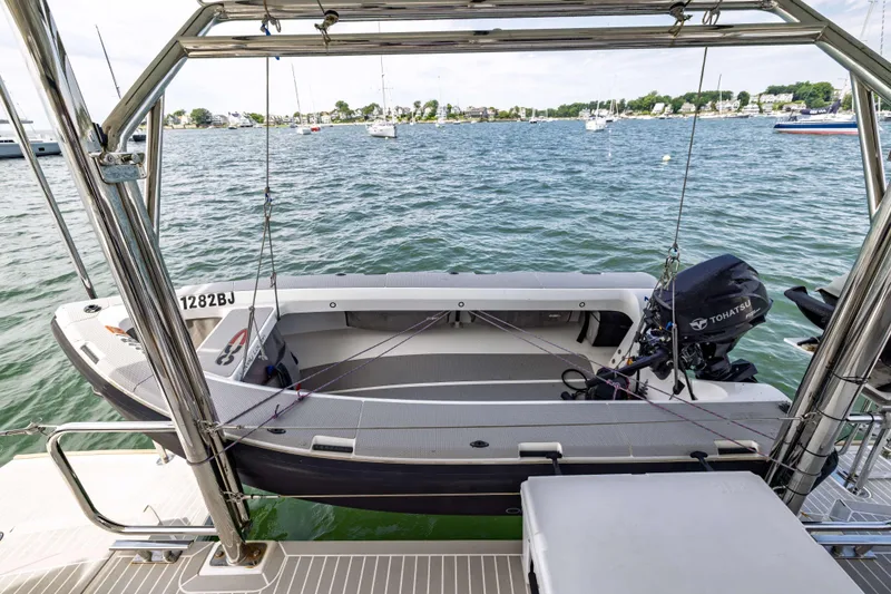 Slide: The Image of Leopard 42 boat with Tohatsu motor, docked on a serene lake, 2022 model. - 21