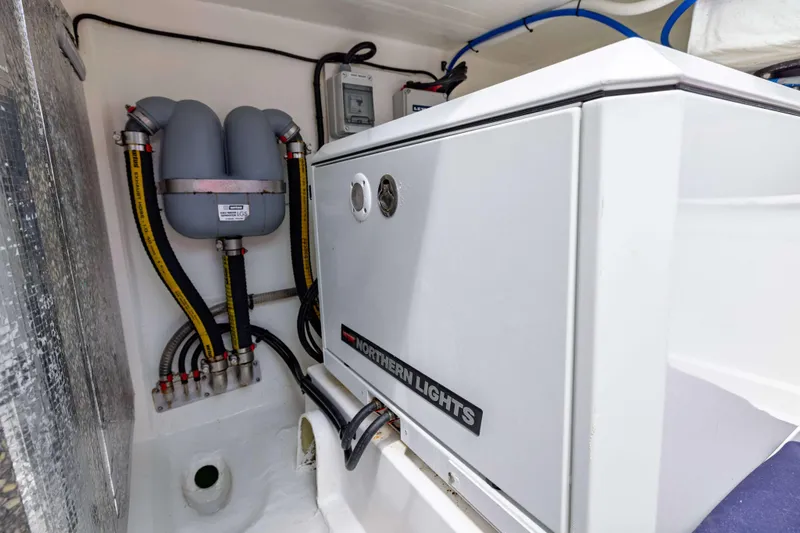 Slide: The Image of Engine compartment of 2022 Leopard 42 yacht with Northern Lights generator and hoses. - 56