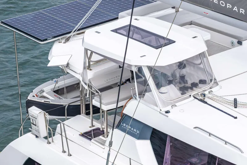 Slide: The Image of 2022 Leopard 42 catamaran with solar panels on deck, docked on water. - 16