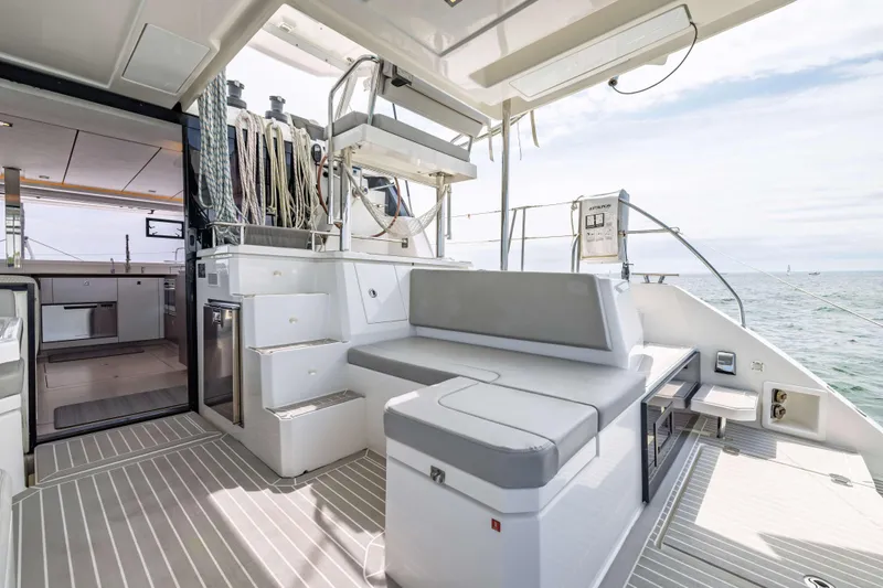 Slide: The Image of Modern Leopard 42 yacht interior, featuring sleek seating and ocean view, 2022 model. - 24