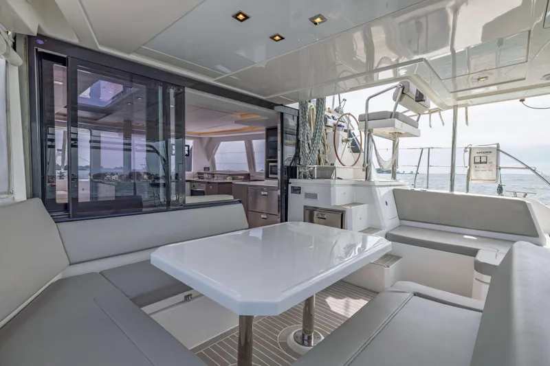 Slide: The Image of Luxurious 2022 Leopard 42 yacht interior with modern seating and ocean view. - 27