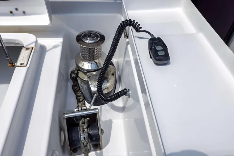 Slide: The Image of Anchor winch system on a 2022 Leopard 42 yacht, featuring a coiled remote control. - 57