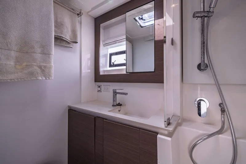 Slide: The Image of Modern bathroom in 2022 Leopard 42 yacht with sleek fixtures and wooden accents. - 51