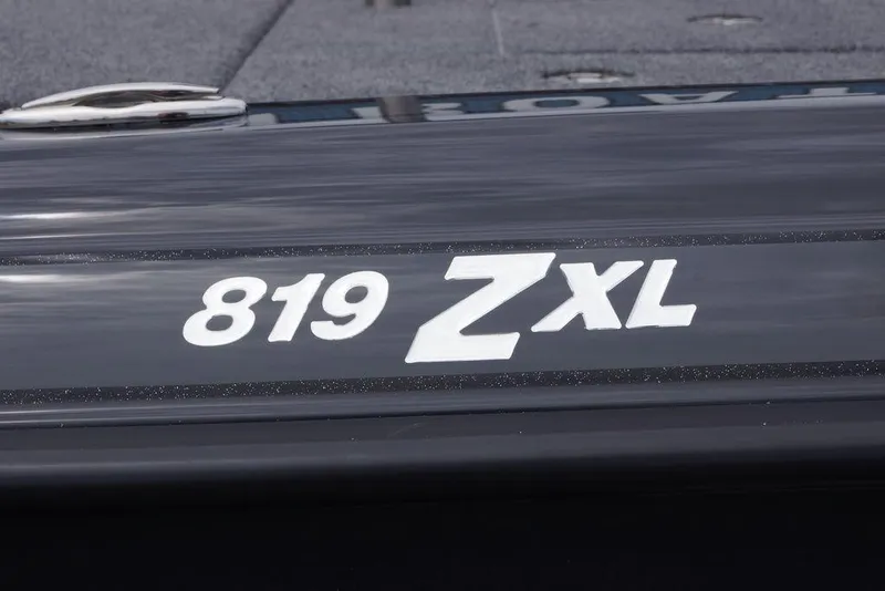 Slide: The Image of Close-up of 2026 Phoenix 819 ZXL model name on a sleek surface. - 10