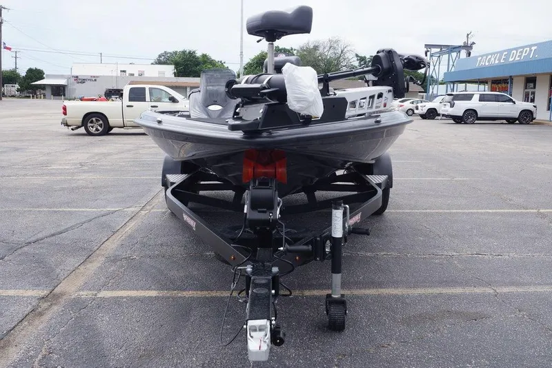 Slide: The Image of 2026 Phoenix 819 ZXL boat on trailer in parking lot near tackle shop. - 11