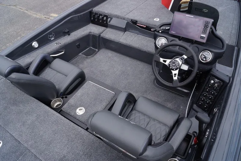 Slide: The Image of Interior of a 2026 Phoenix 819 ZXL boat with modern dashboard and seating. - 19