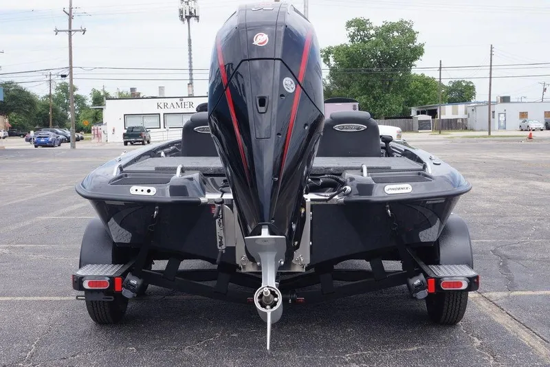 Slide: The Image of 2026 Phoenix 819 ZXL boat on trailer, rear view in parking lot. - 2