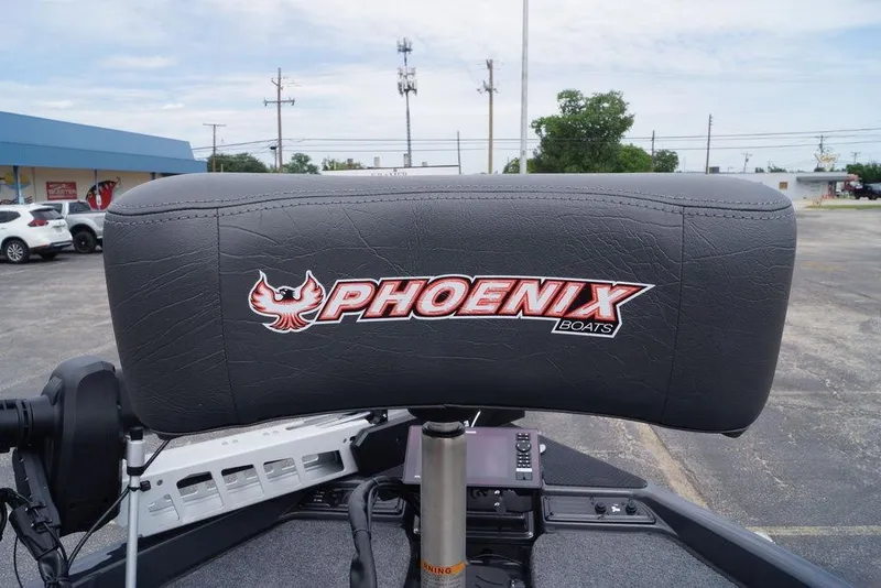Slide: The Image of Phoenix 819 ZXL 2026 boat seat with logo in parking lot setting. - 20