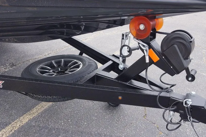 Slide: The Image of Trailer hitch and wheel assembly of 2026 Phoenix 819 ZXL boat trailer. - 21