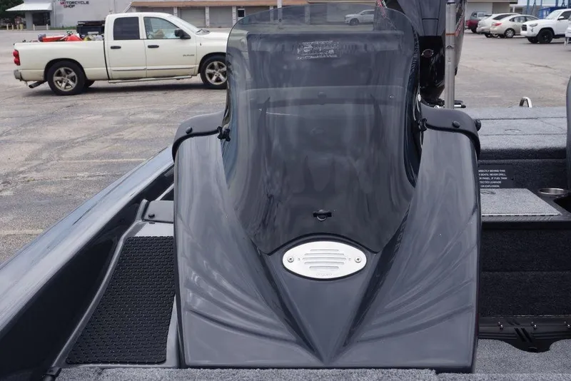 Slide: The Image of 2026 Phoenix 819 ZXL boat with sleek design and windshield, parked in a lot. - 4