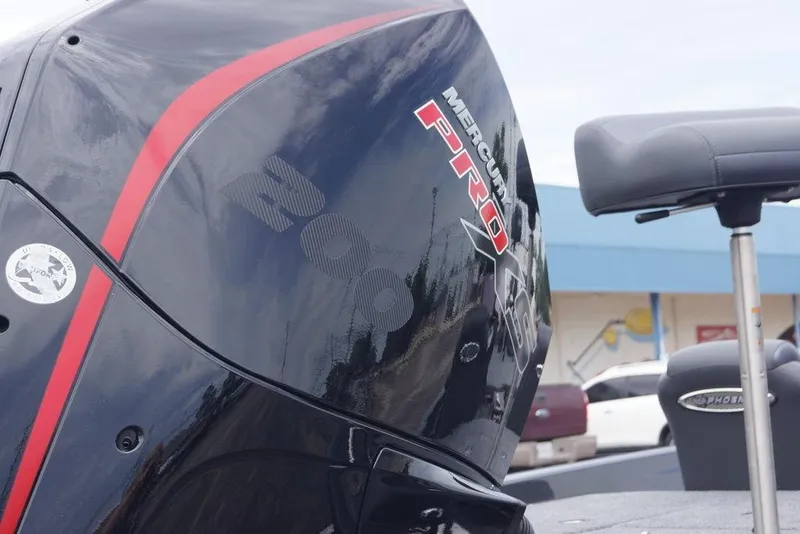 Slide: The Image of Outboard motor on a Phoenix 819 ZXL boat, 2026 model, with Mercury Pro branding. - 6